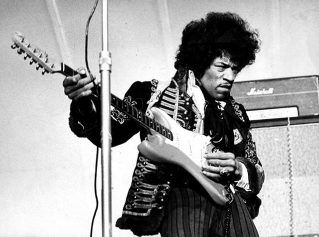 Hendrix had the archetypal alien body with long limbs and a large head. This black and white image disguises his green skin.